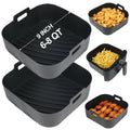 Square black silicone air fryer liners, stacked with ridged pattern and lift handles