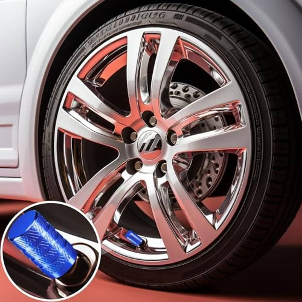 Blue tire valve stem cap shown beside a car wheel; anodized aluminum knurled texture