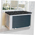 Black window AC drip cushion placed on top of a window air conditioner unit.