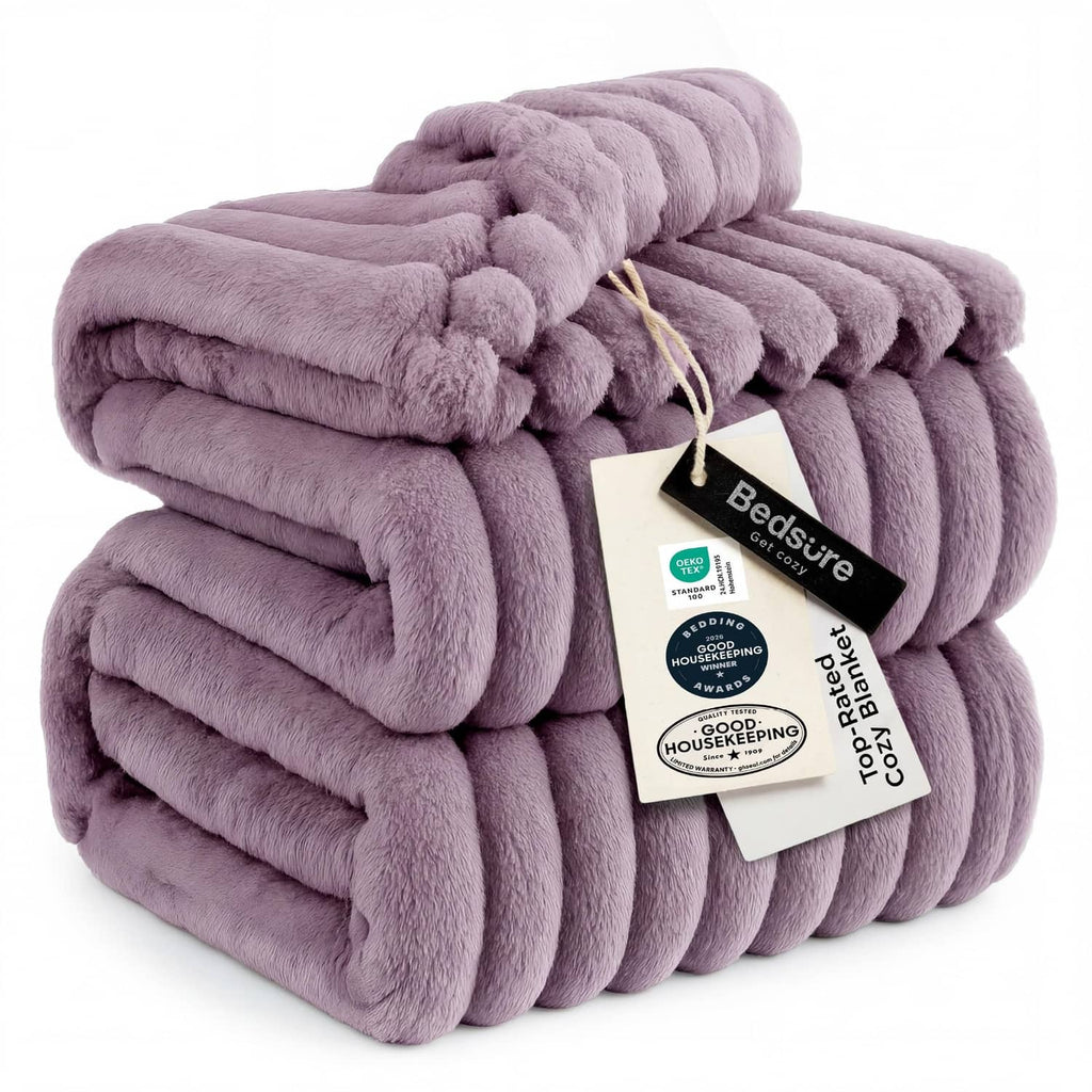 Light purple fleece blanket with chunky ribbed texture, neatly folded with tag