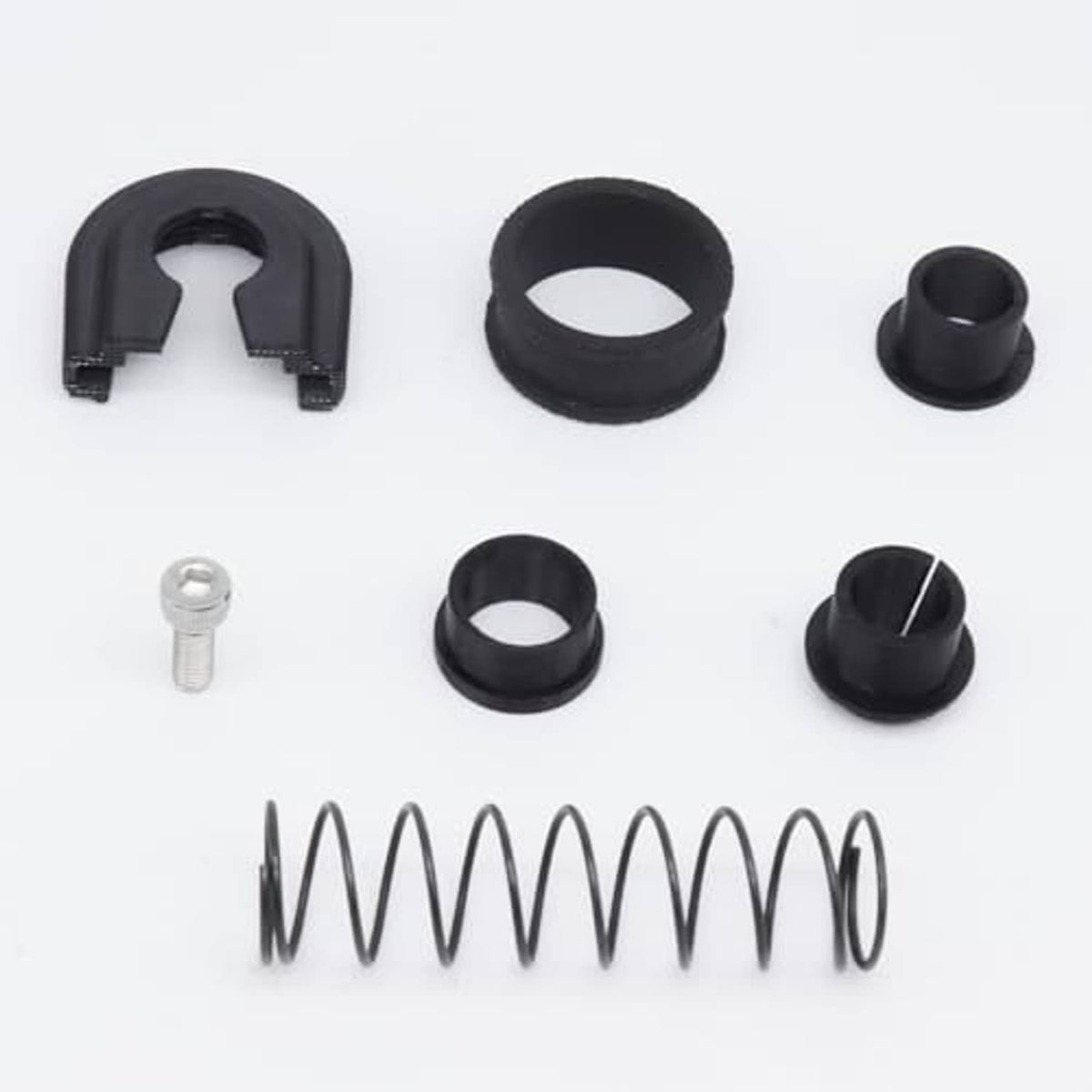 Manual shifter reverse lever repair kit components: U-clip, rings, sleeves, spring, bolt.