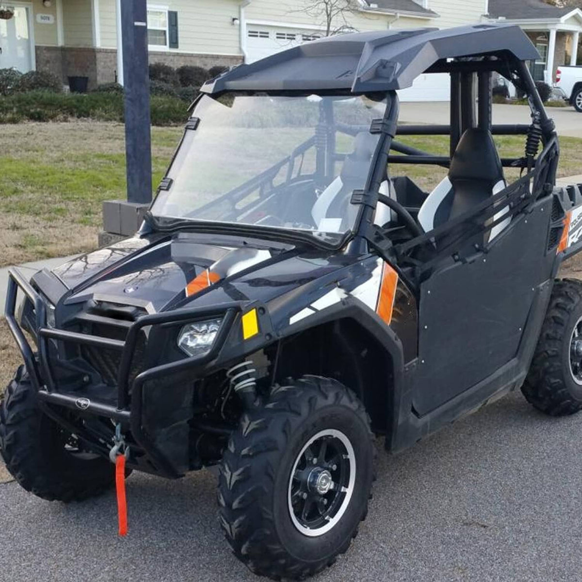 UTV full windshield with clear polycarbonate panel and black mounting brackets