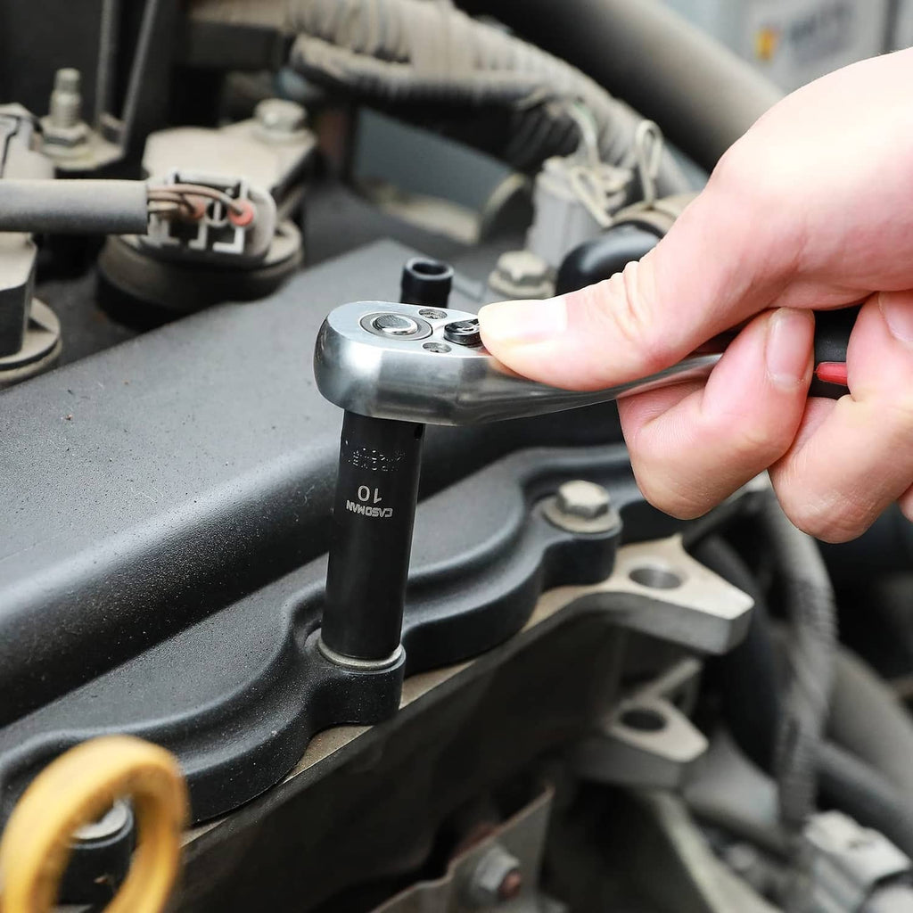 Hand using a 1/4-in drive impact socket on an engine component
