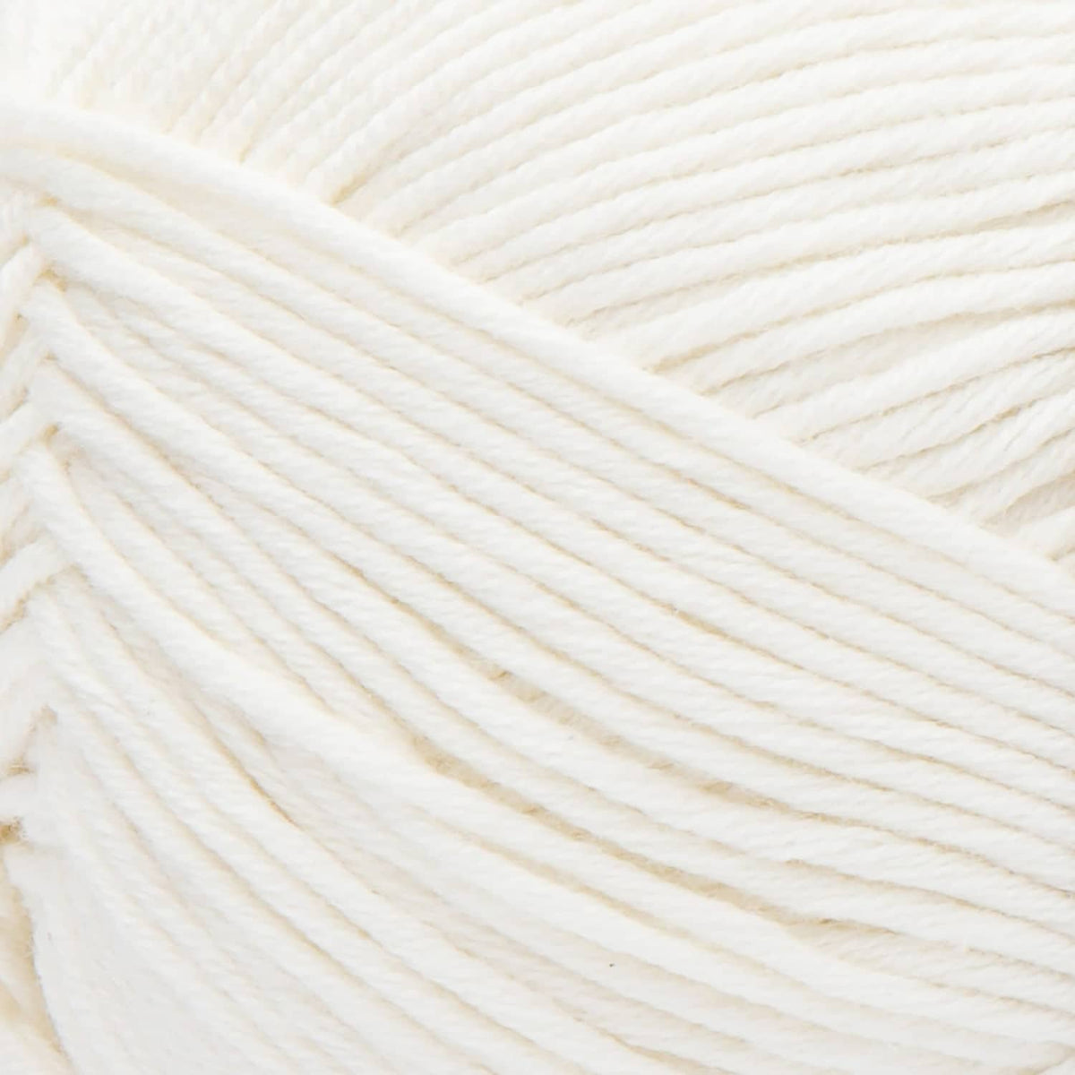 Close-up of off-white cotton-acrylic yarn strands, light weight soft texture