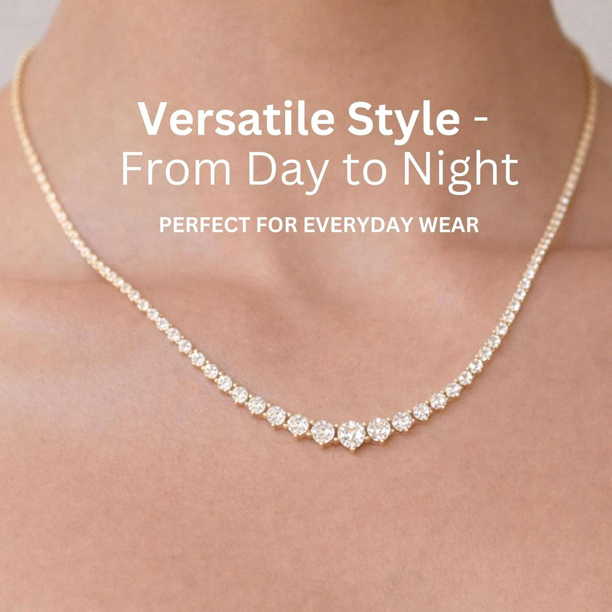 Gold-plated tennis necklace with white CZ stones along the curve of the neckline