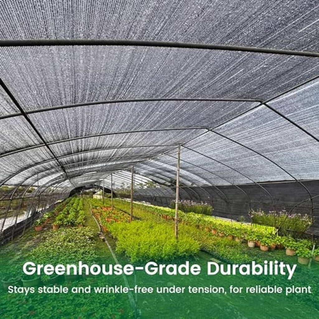 Dark woven sun shade cloth stretched over greenhouse frame with taut rows of netting