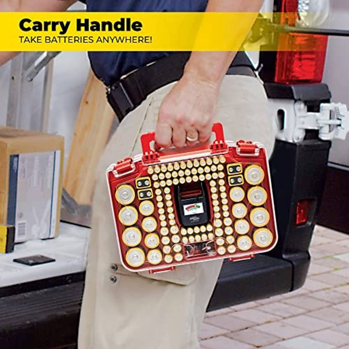 Red battery organizer case with carry handle, held in hand with tester panel