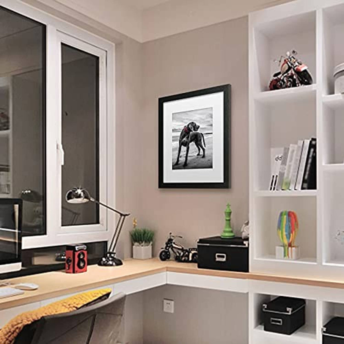 Set of 2 picture frames with dark borders and white mats mounted on wall