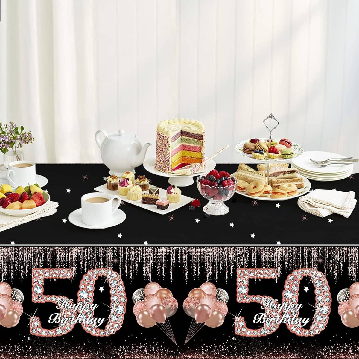 Black birthday tablecloth with repeated “Happy Birthday 50” print and rose-gold balloon graphics