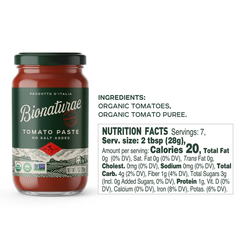 Tomato paste jar with green cap and label showing no salt added