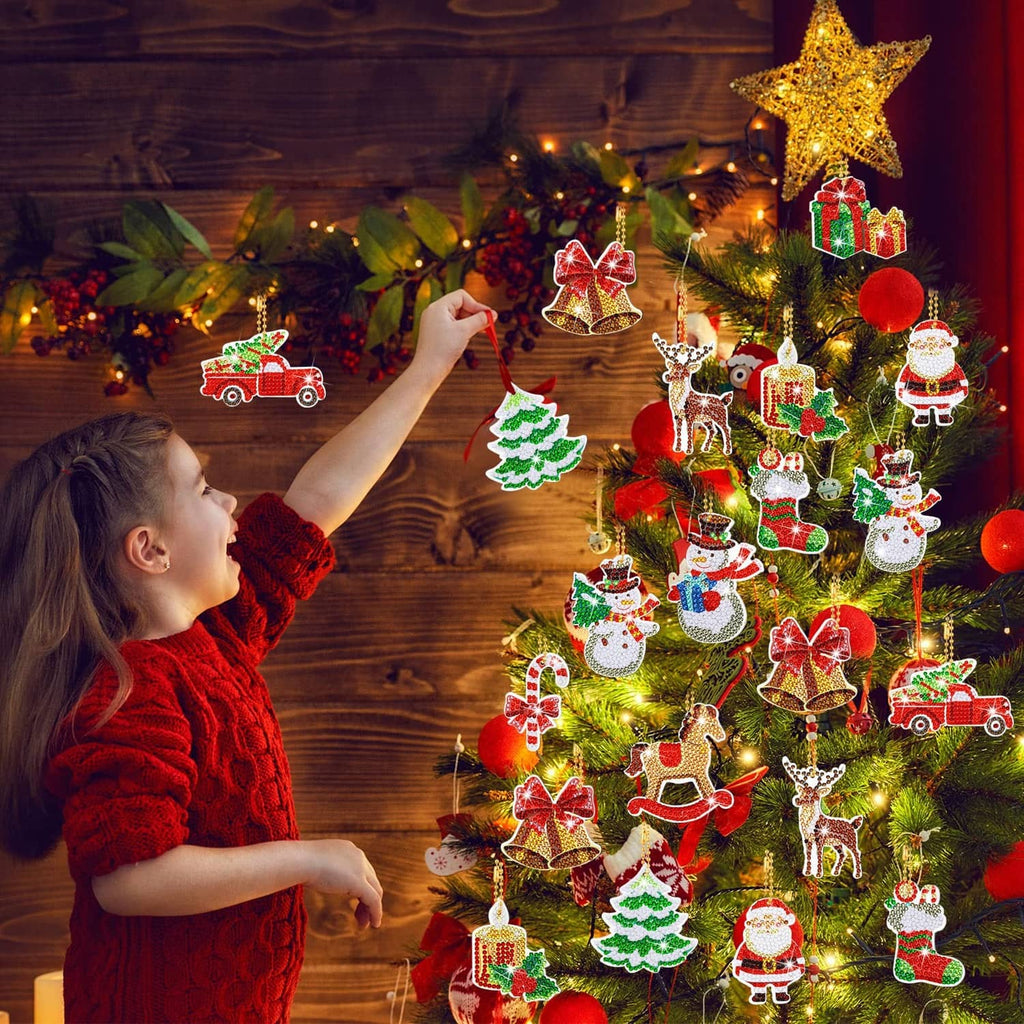 Assorted diamond art Christmas ornaments with shiny bead look hanging on a decorated tree
