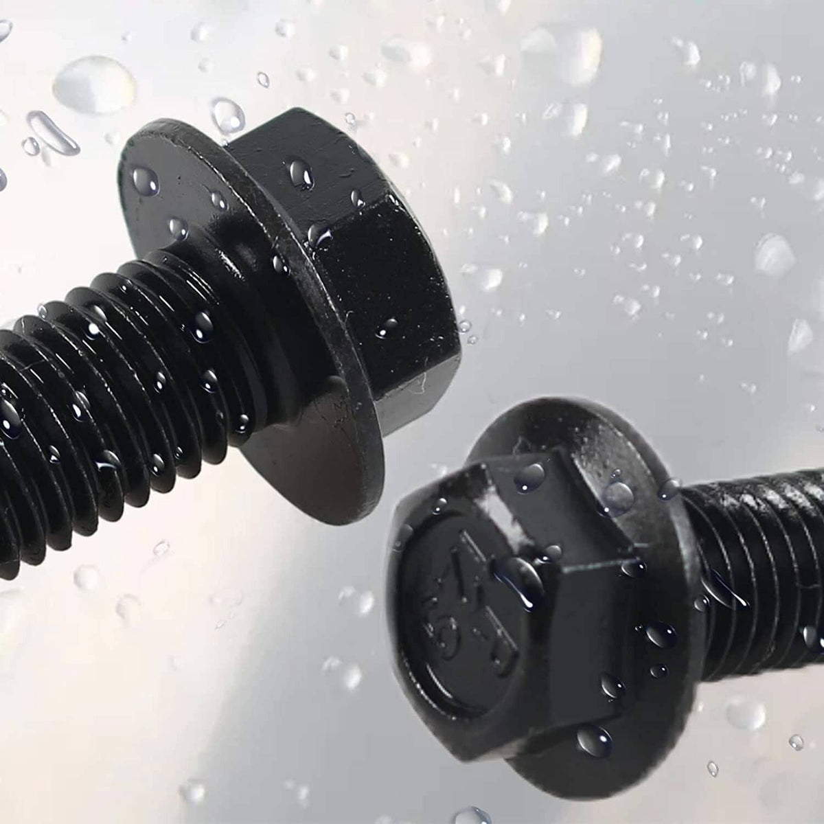 Black flexplate bolts with washer-style heads, shown with water droplets