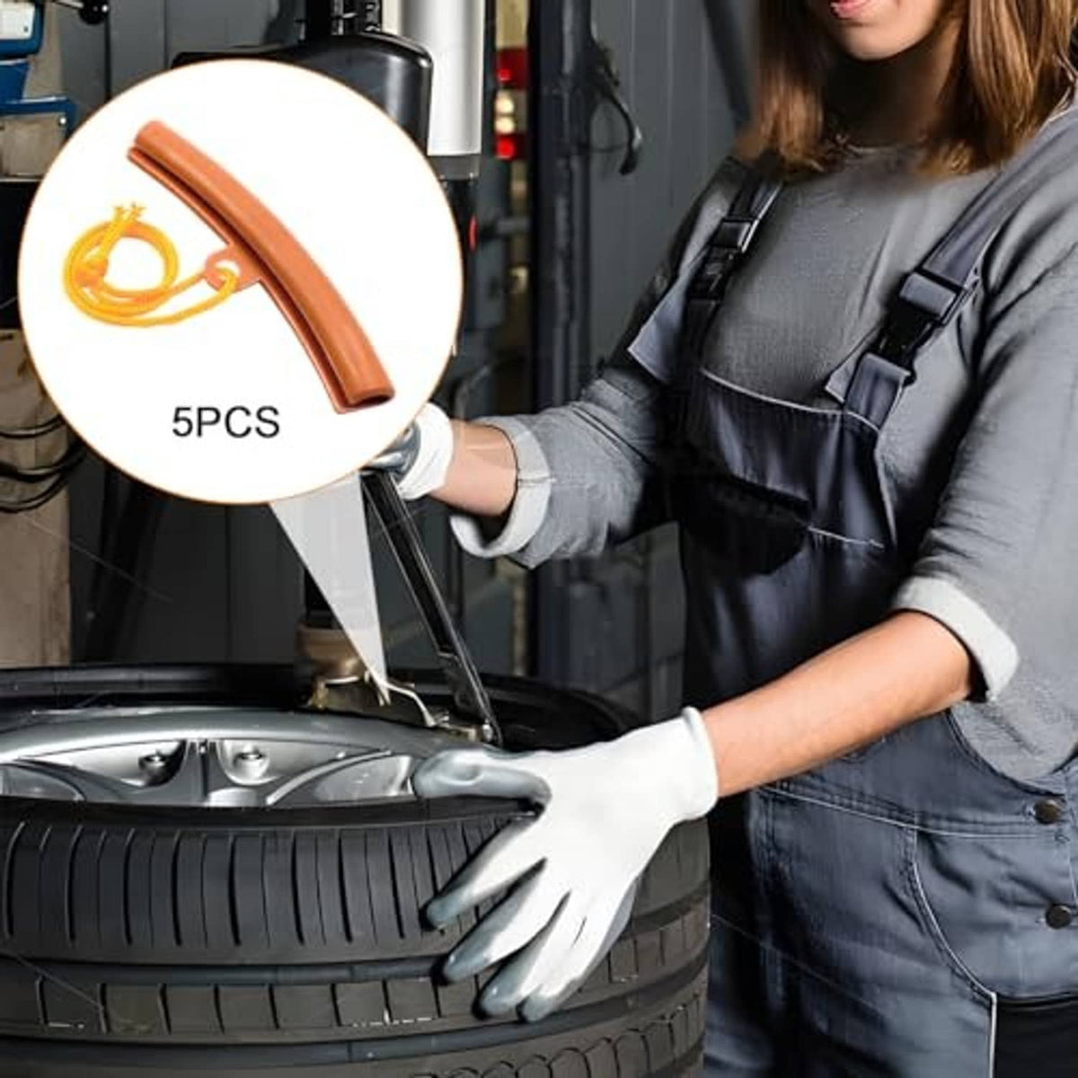 Orange rim protector strip included with yellow cord, shown with a tire-changing technician.