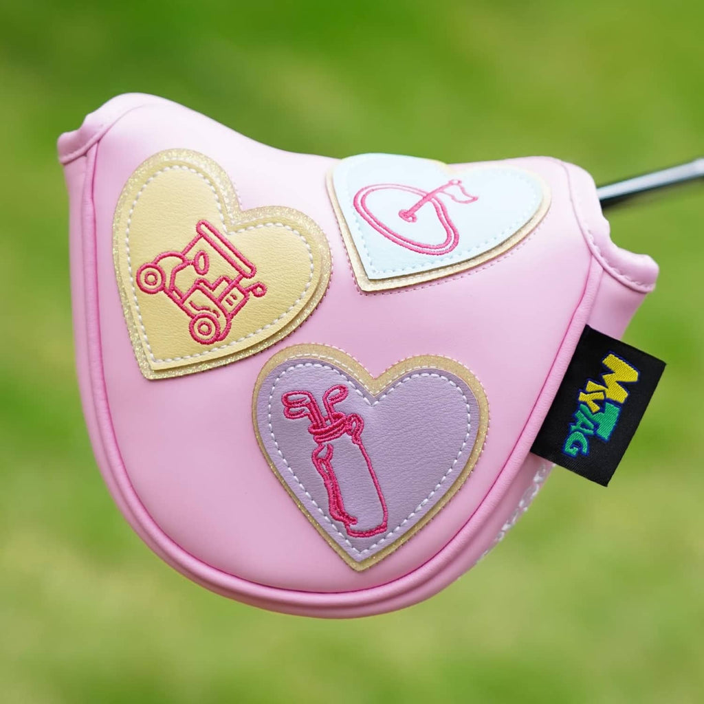 Pink mallet putter cover with three heart appliques featuring golf-themed icons.