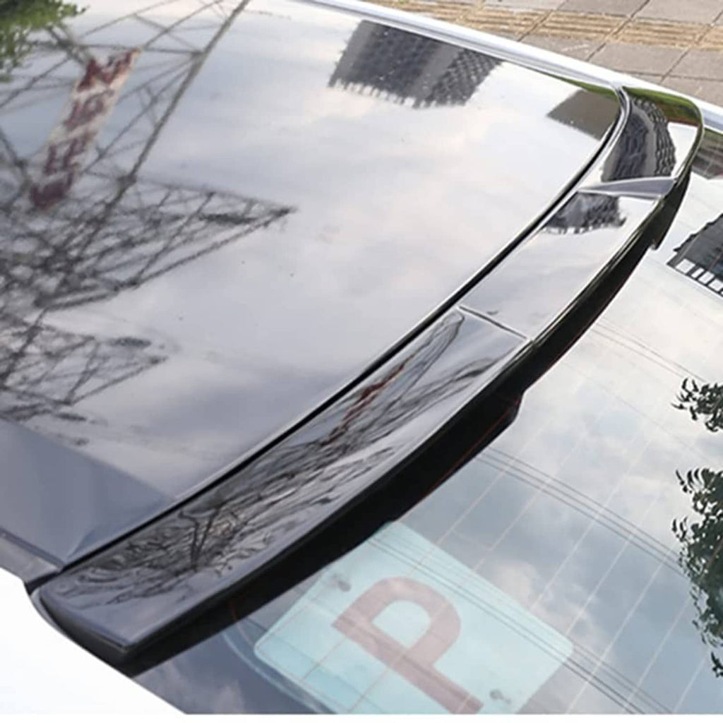 Glossy black roof spoiler wing on car rear roof edge, side view