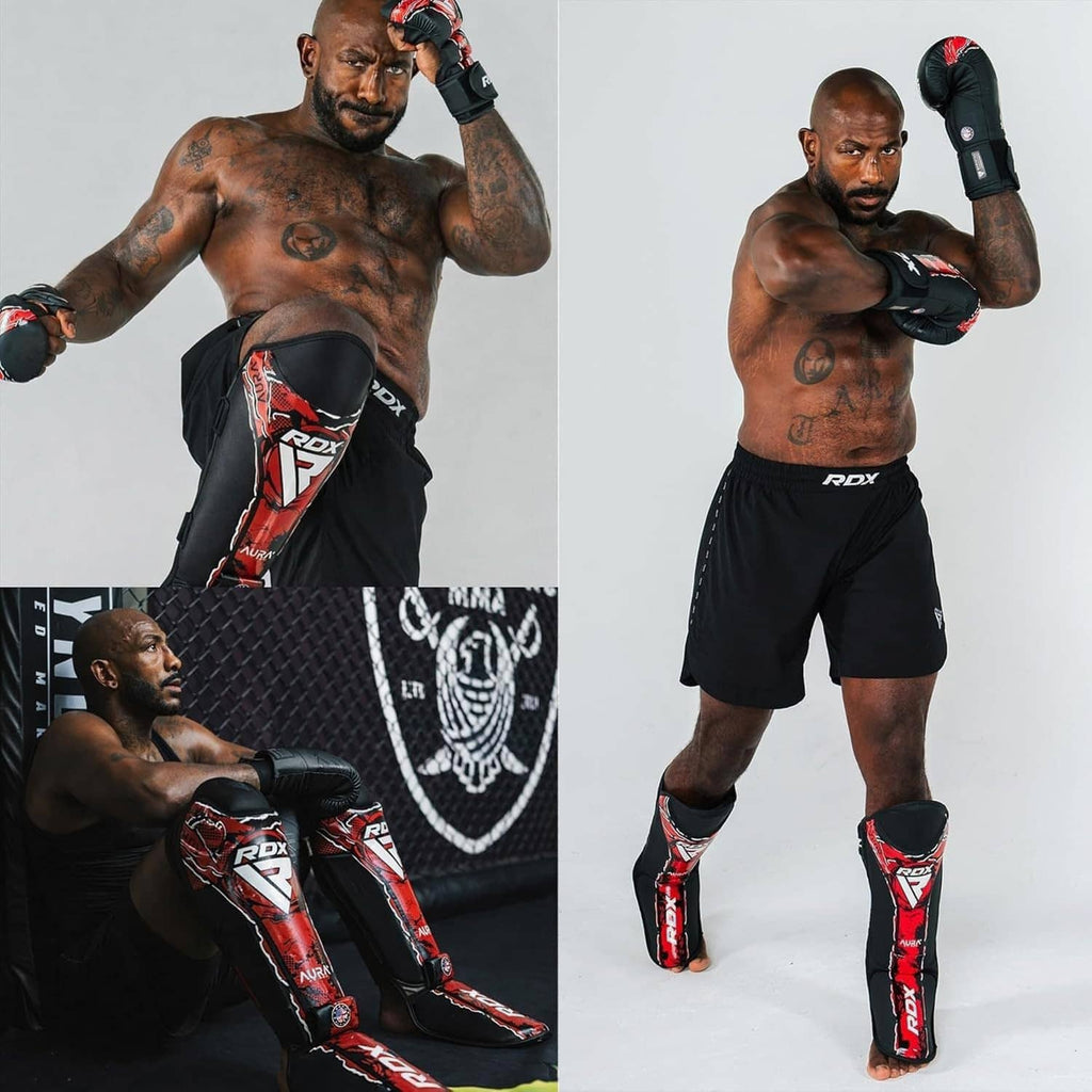 RDX shin instep pads worn by a fighter; black pads with red graphic trim
