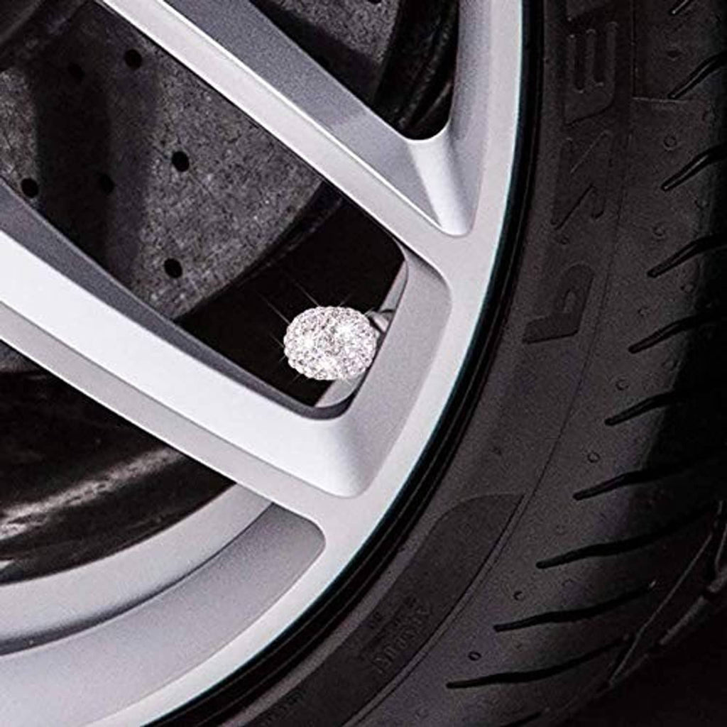 Crystal rhinestone valve stem cap on car wheel rim opening