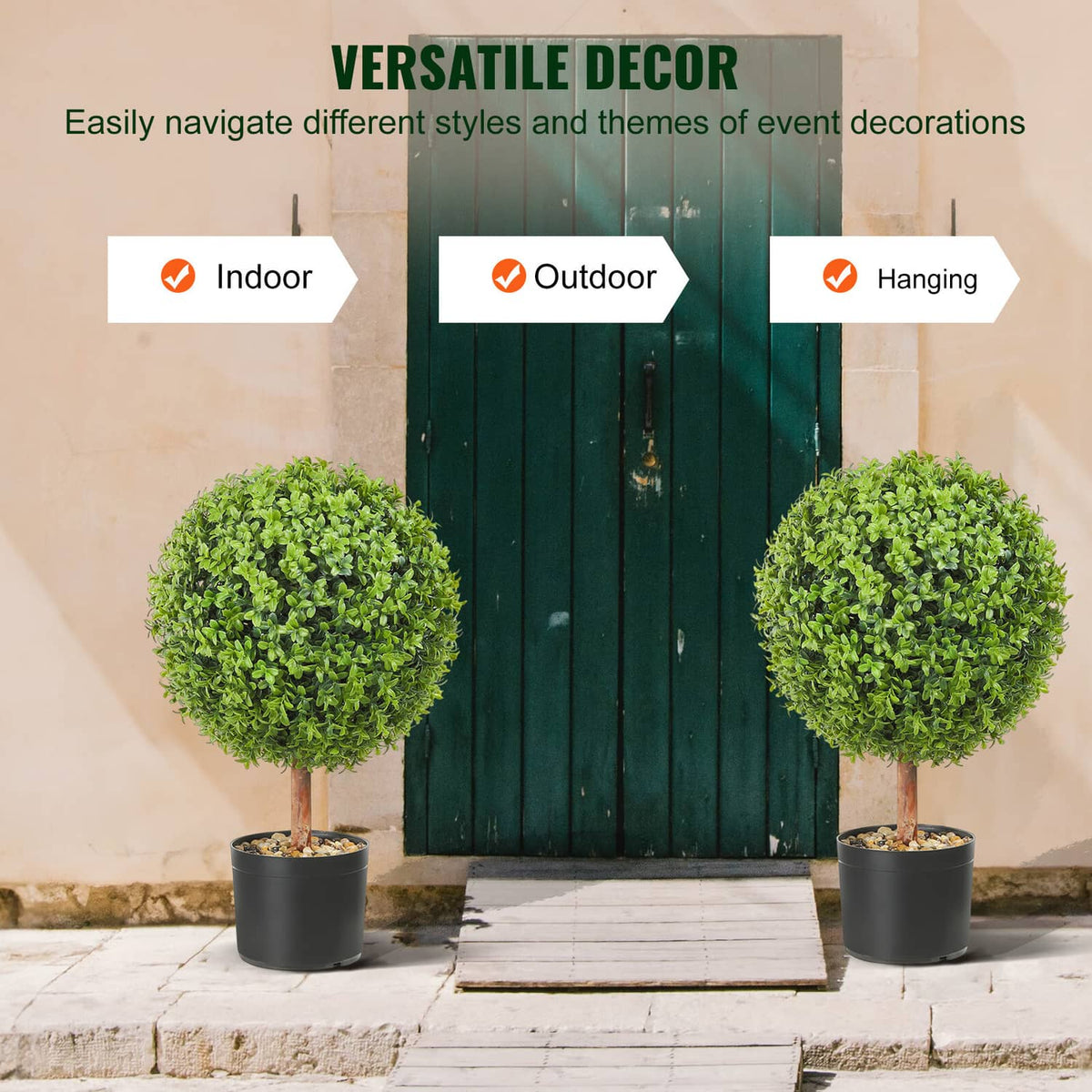 Two artificial topiary trees with bright green foliage in black pots on patio