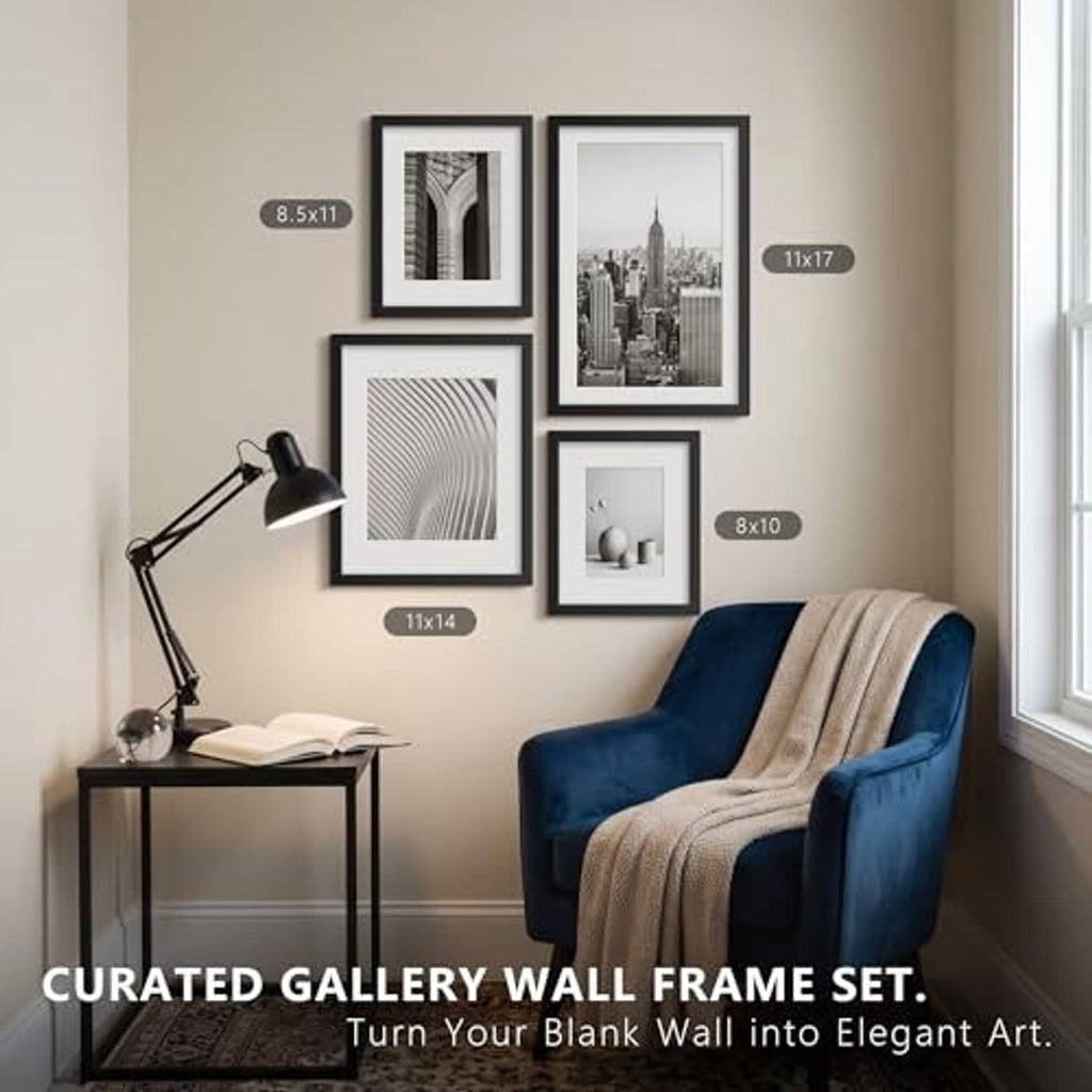 Black picture frame gallery wall set with four frames of different sizes.
