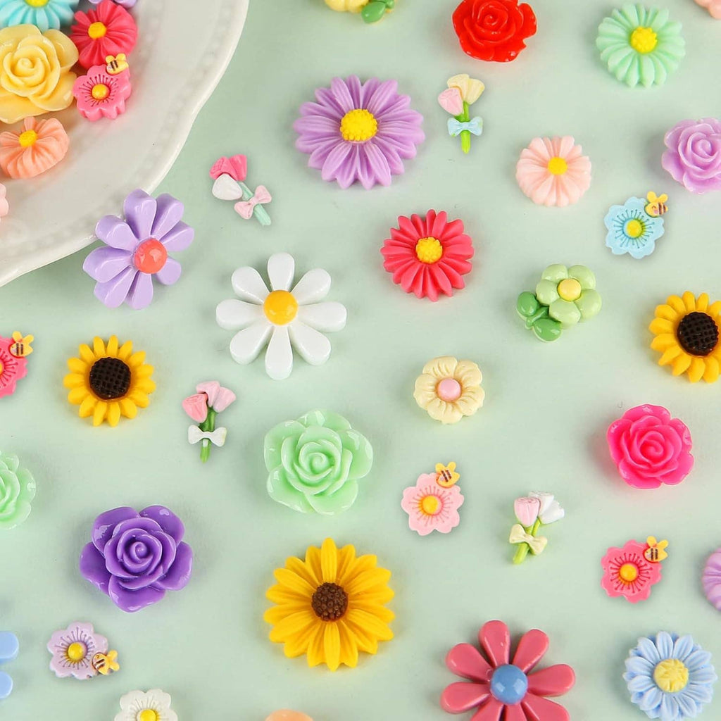 Assorted mini flatback resin flowers in purple, pink, yellow, blue, and green