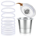 White rubber gasket rings for reusable K cups, shown stacked with one placed seal-side up