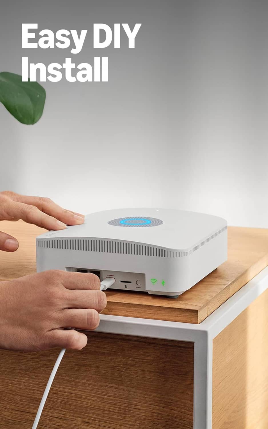 White base station on a shelf with blue ring status light