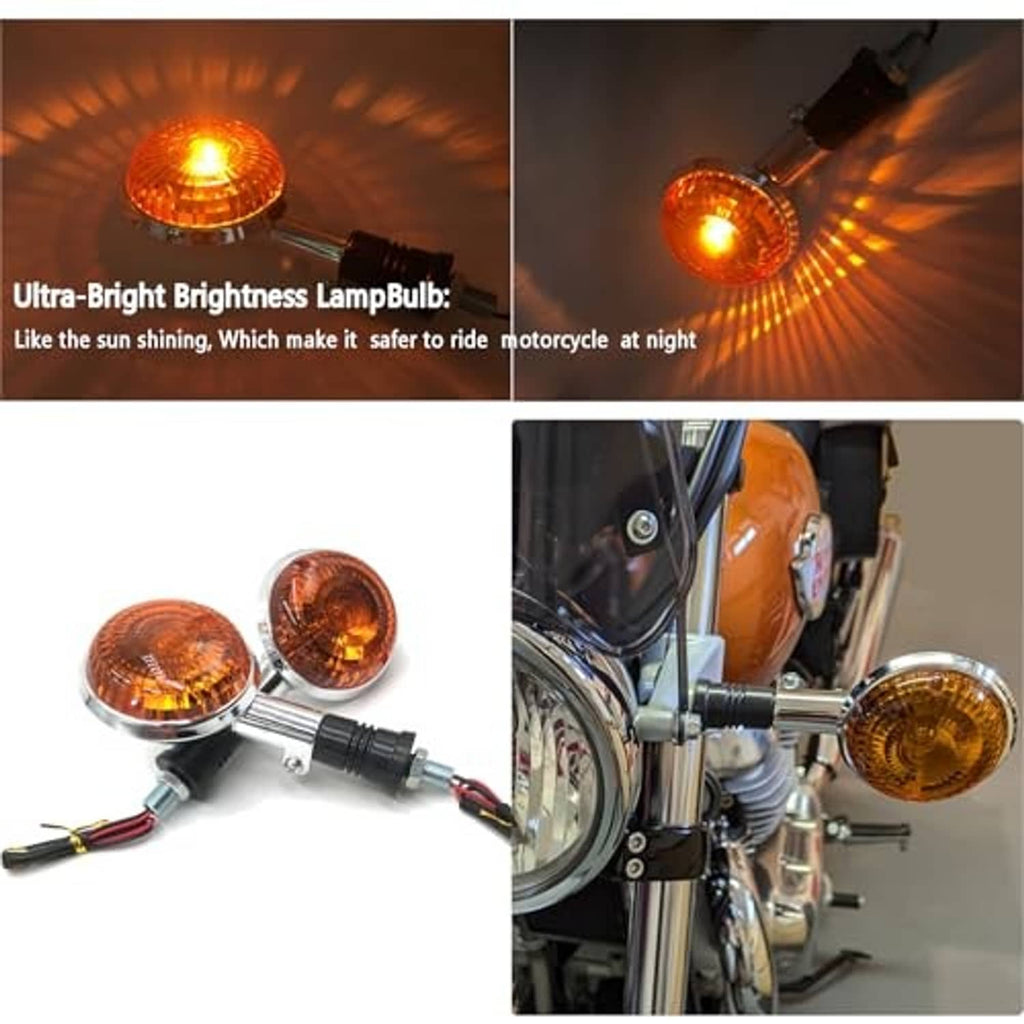 Amber motorcycle turn signal lights, one glowing, mounted on a chrome handlebar