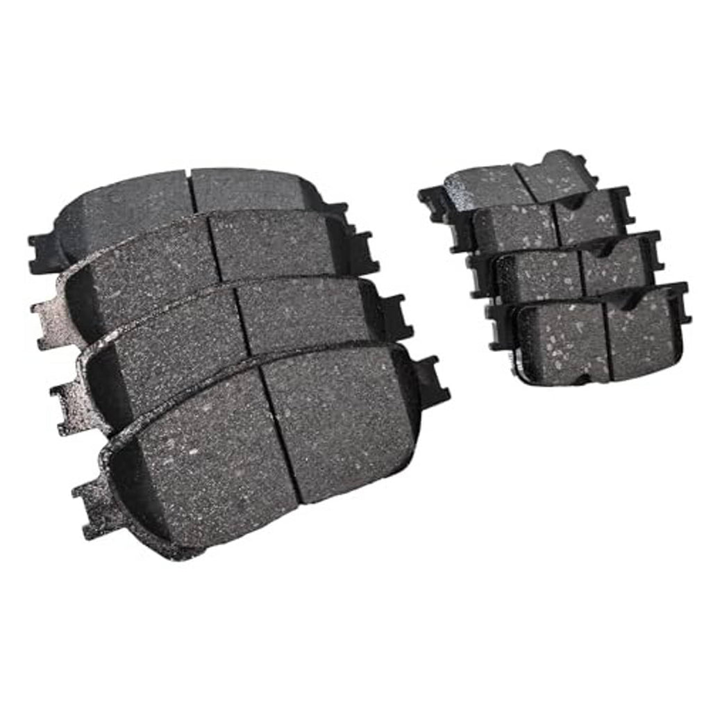 Assorted ceramic brake pads arranged in two groups, dark gray with mounting hardware