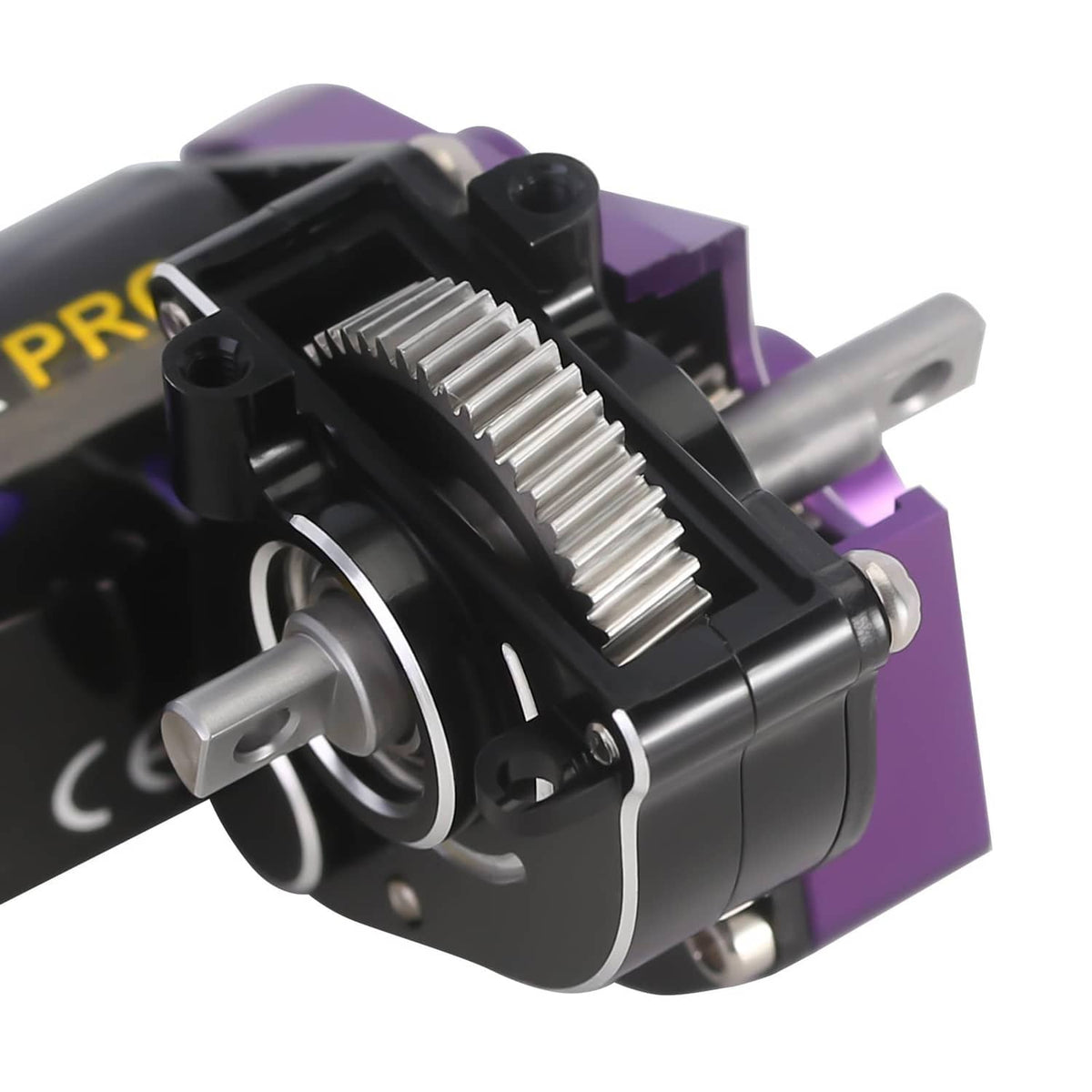 Brushed transmission motor, close-up of silver gear and output shaft, purple casing