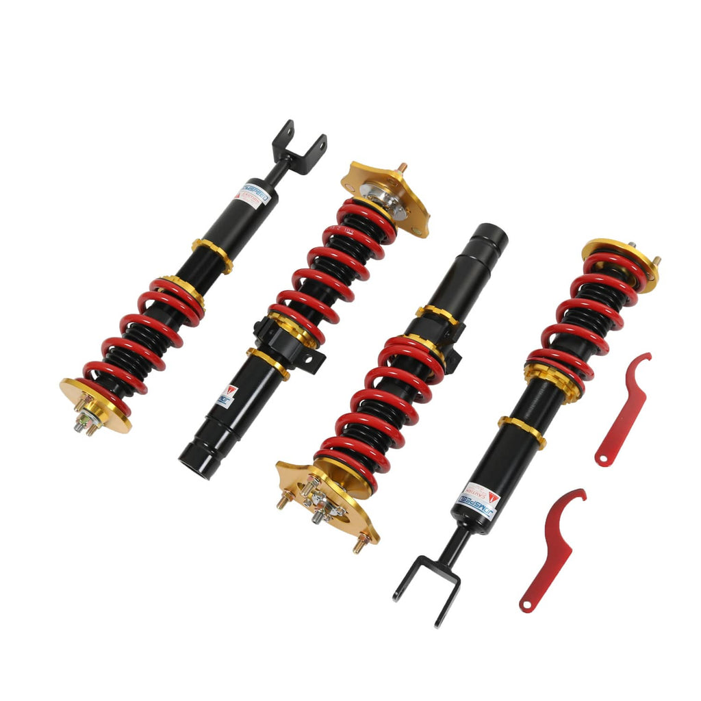 Four-piece coilover suspension set with red springs, black shocks, gold mounts