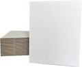 White cardboard sheets with corrugated backing, shown stacked