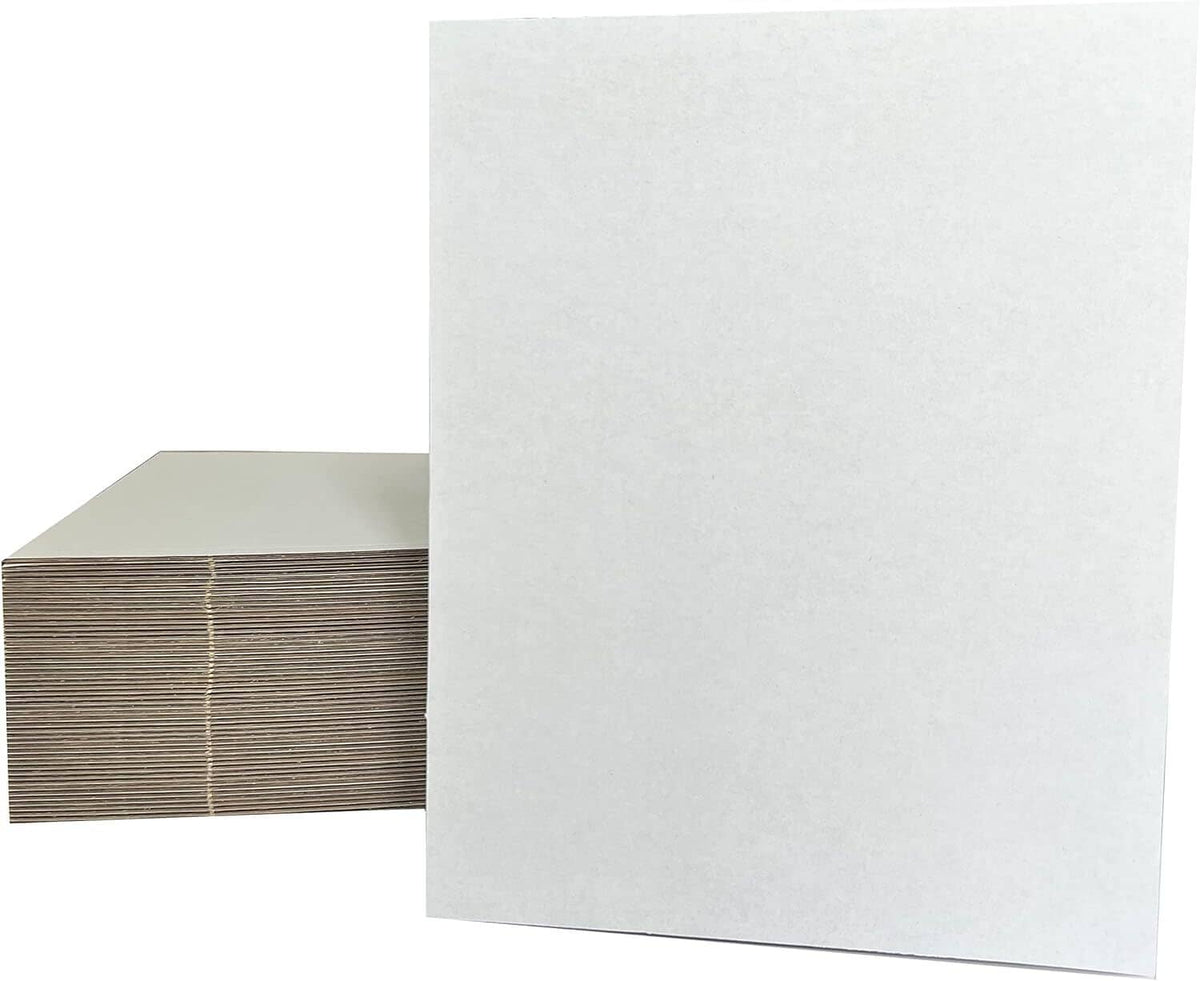 White cardboard sheets with corrugated backing, shown stacked