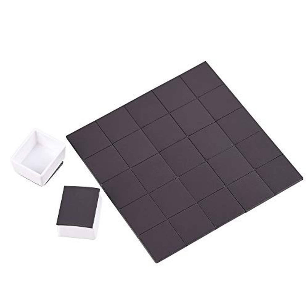 Dark magnetic watercolor half-pan sheet with a few white empty cups