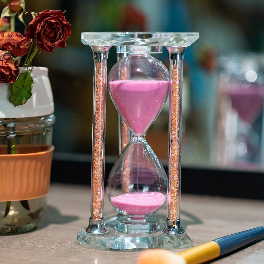Pink sand heart hourglass with clear glass columns and glittering rose-gold side details