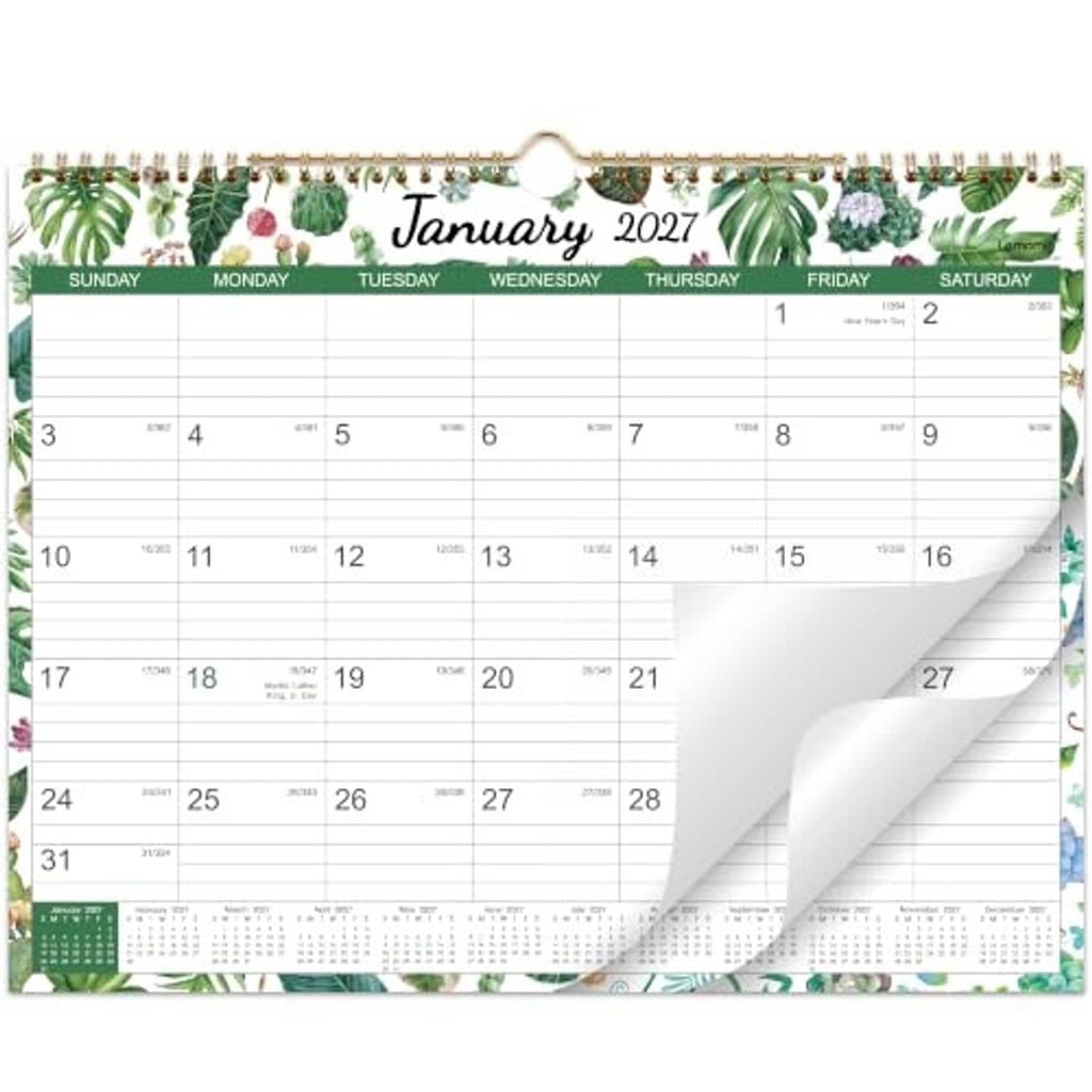 Wall calendar open to January 2027 showing monthly date grid and perforated pages