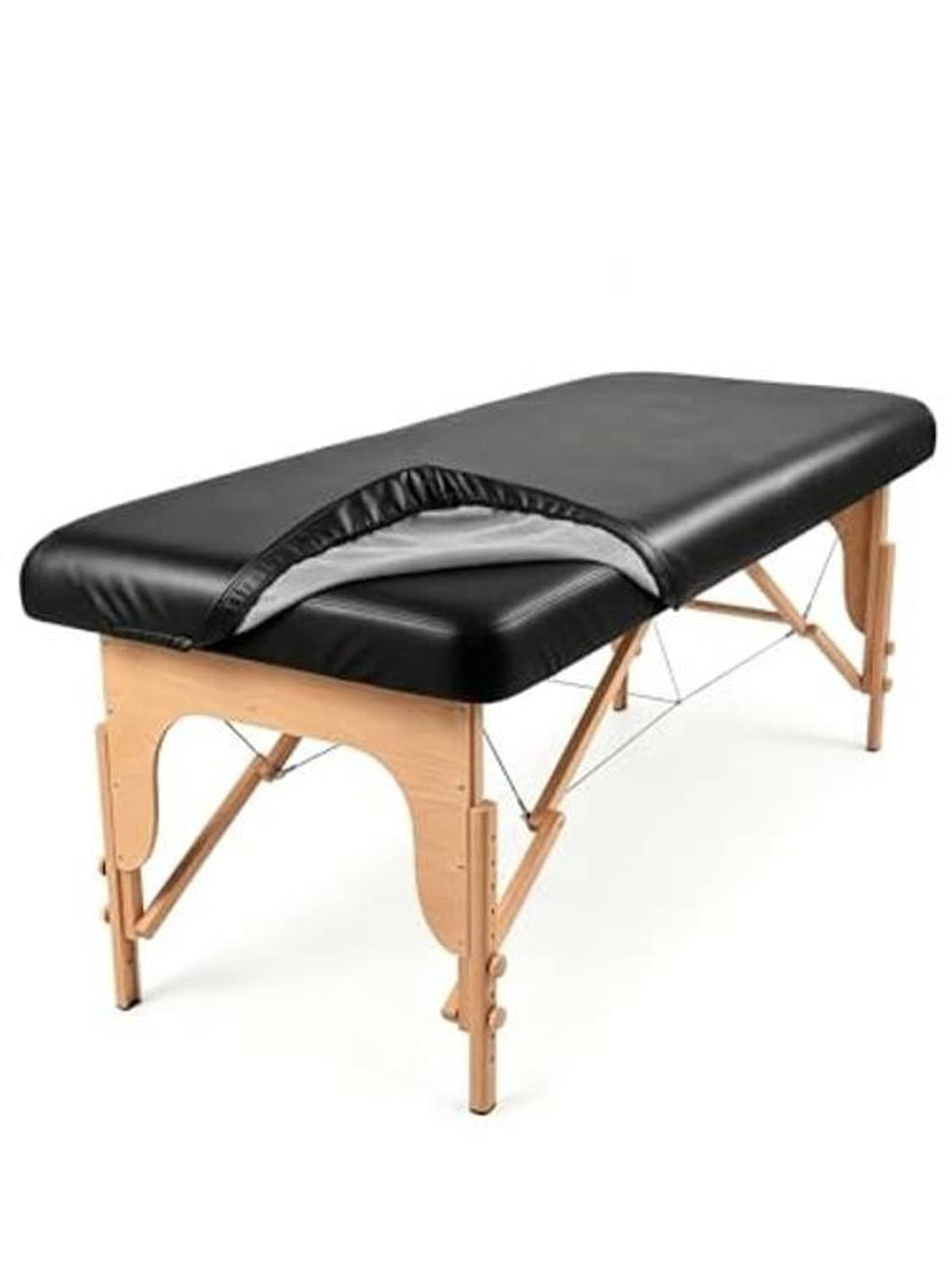 Black massage table cover on wooden massage table with arched head opening and elastic straps