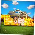 Glowing Thanksgiving inflatable letters and turkey figure, yellow plaid and orange decor