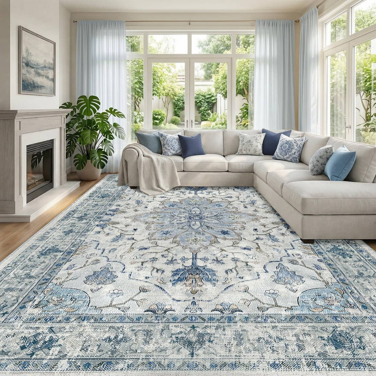 Rectangular washable area rug with blue, white, and gray ornate distressed pattern