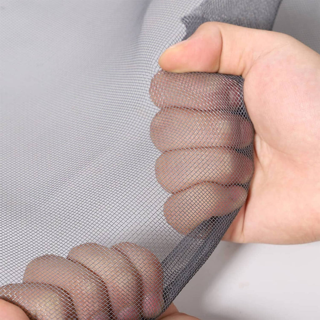 Charcoal black window screen mesh with spline edge, hand holding for fit