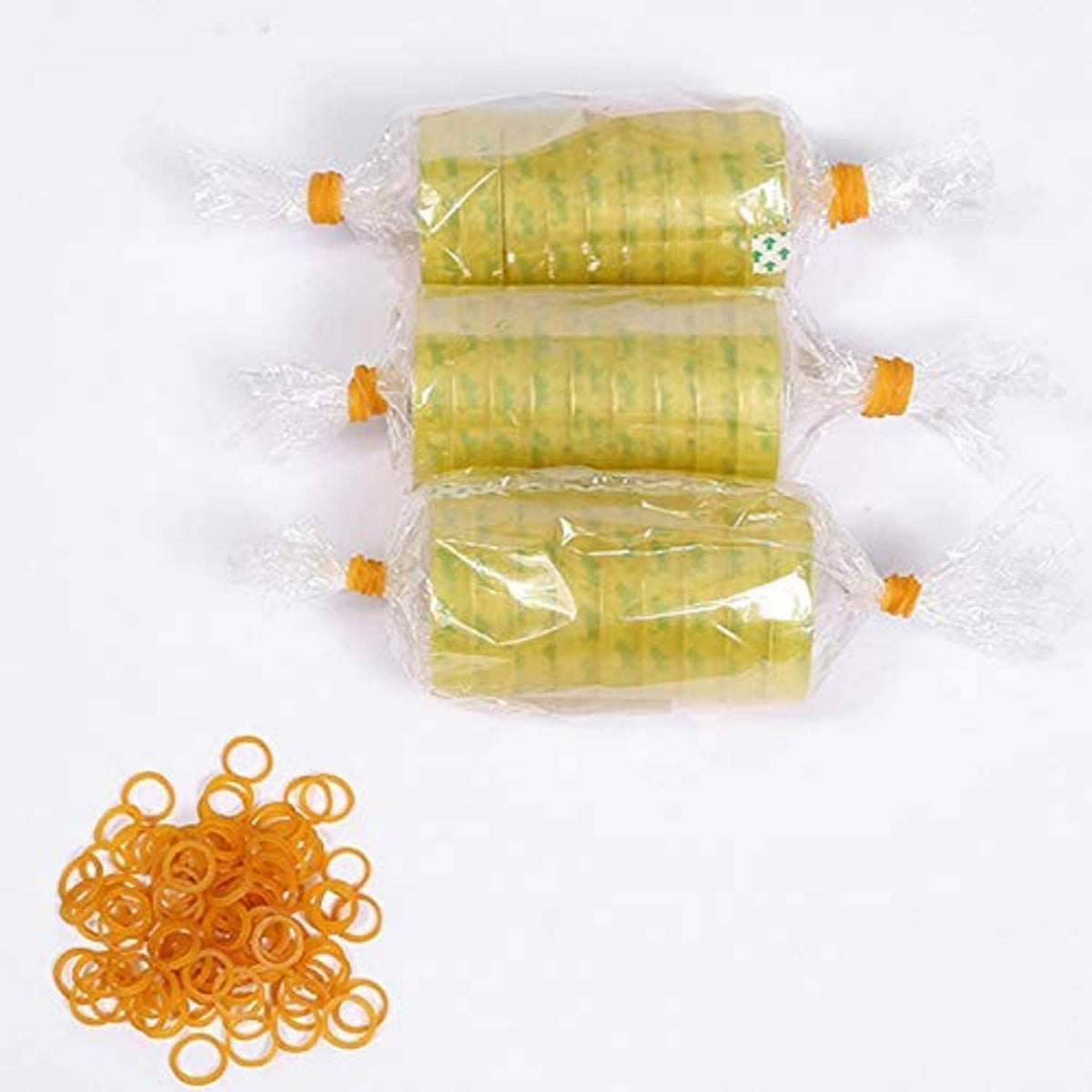 Yellow mini rubber bands next to a sealed bag package with green items
