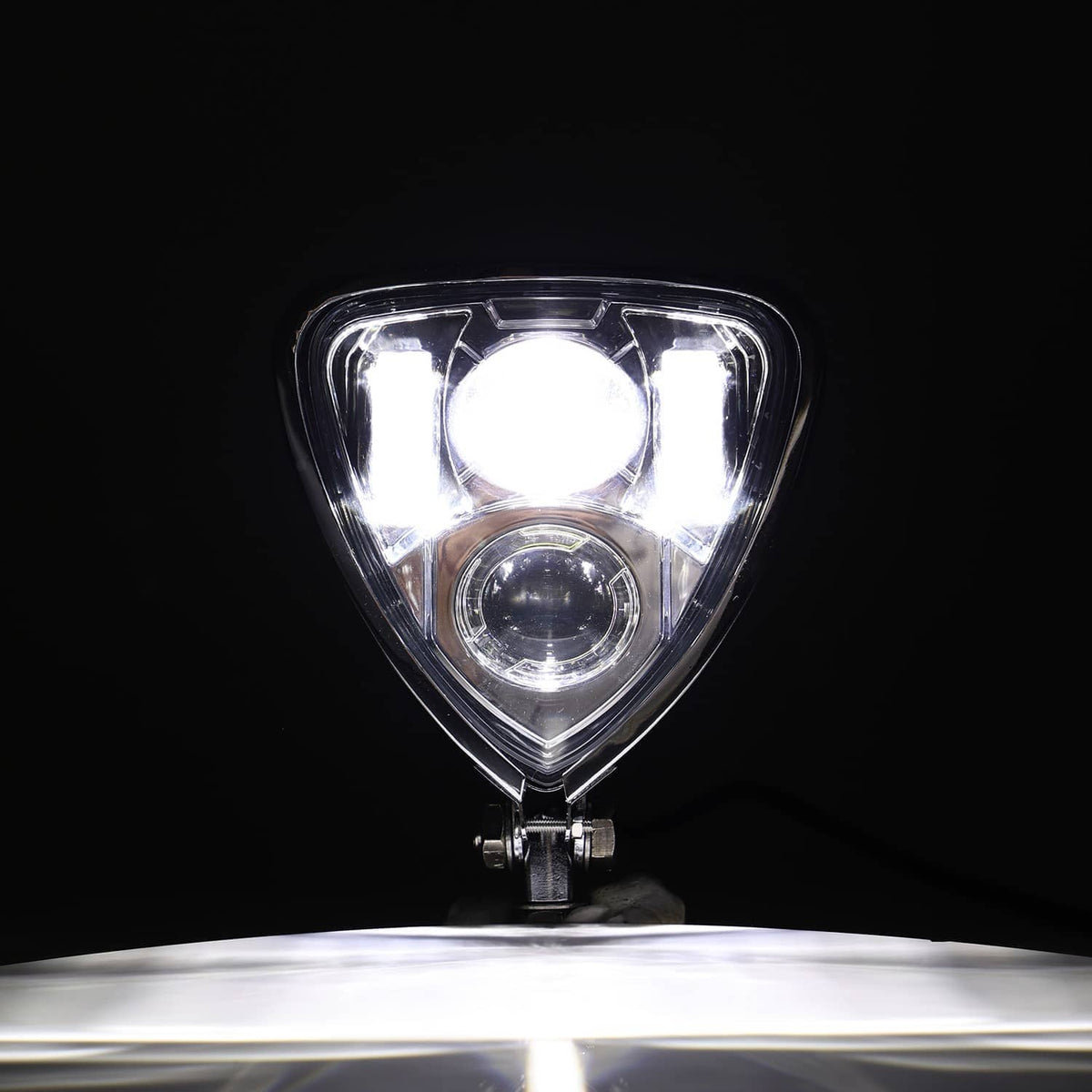 Chrome triangle motorcycle headlight assembly with round projector-style lens and two light beams
