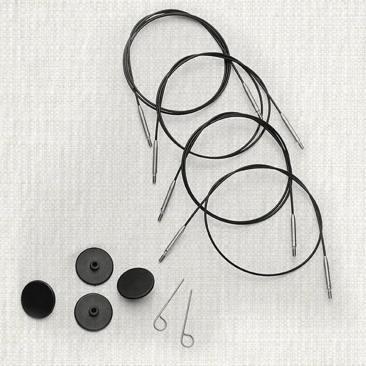 Black nylon-coated stainless steel circular knitting cables with silver needle tips and caps
