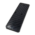 Black rubber tire changer pad with raised ridges and screw holes
