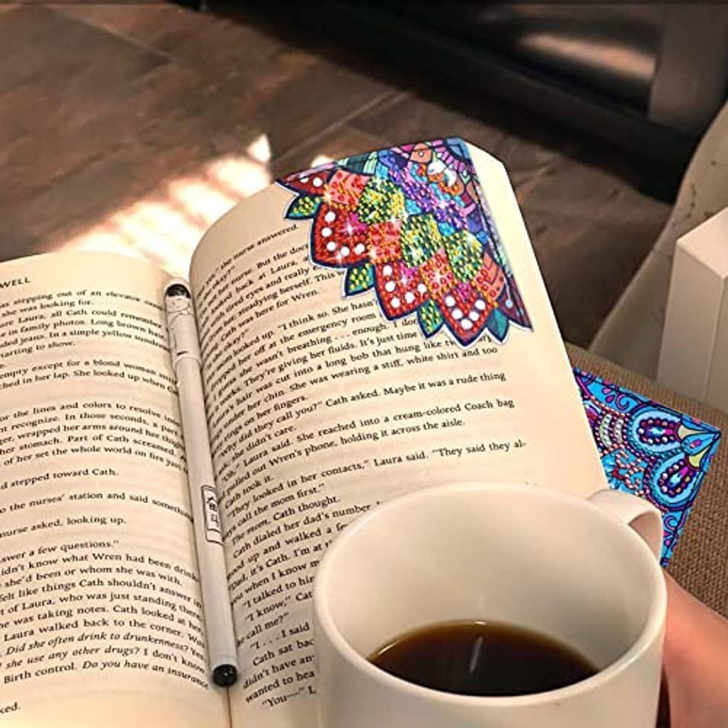 Diamond art bookmark with colorful mandala design tucked into an open book page