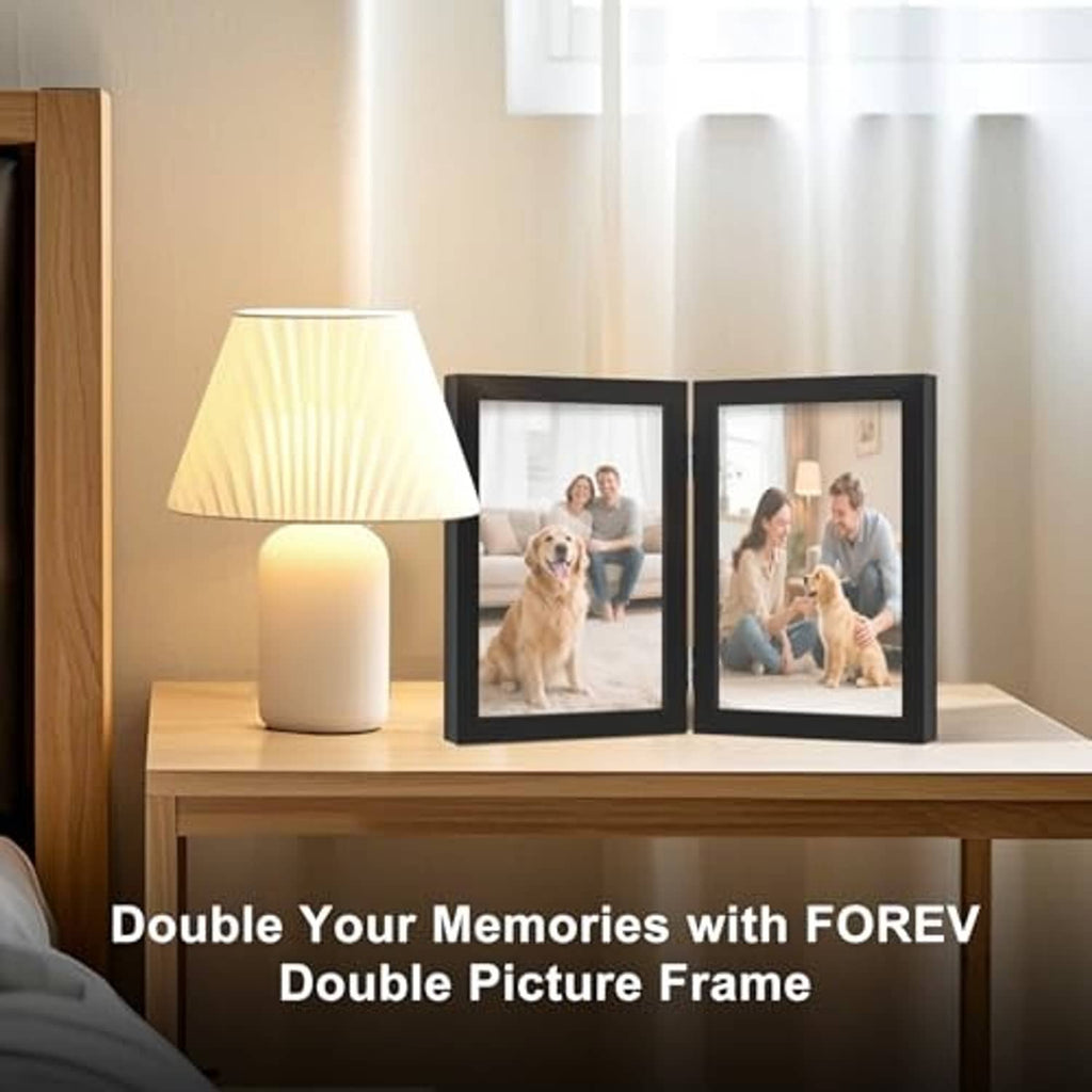 Black double hinged wooden photo frame with clear glass, standing with two photos shown