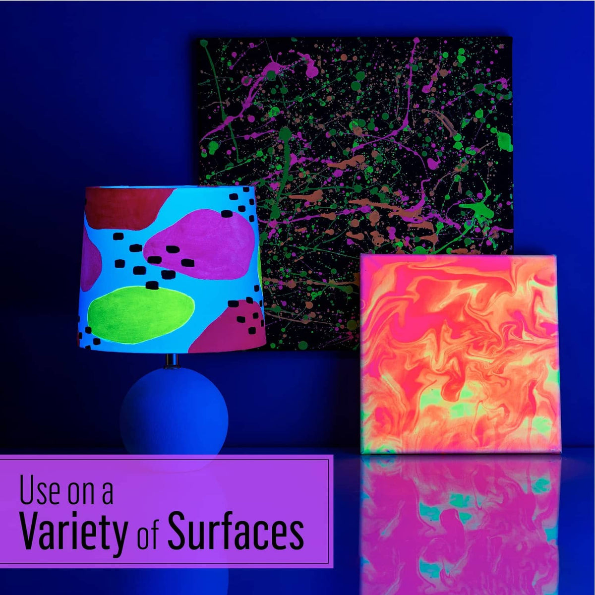 Glow-in-the-dark paint showing illuminated artwork and supplies on a tabletop