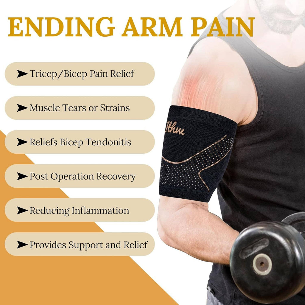 Black bicep brace with copper dotted arc design, worn on upper arm