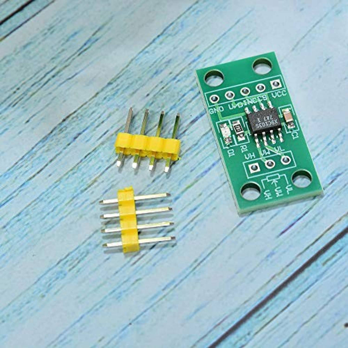 Green PCB digital potentiometer module with separate yellow pin headers