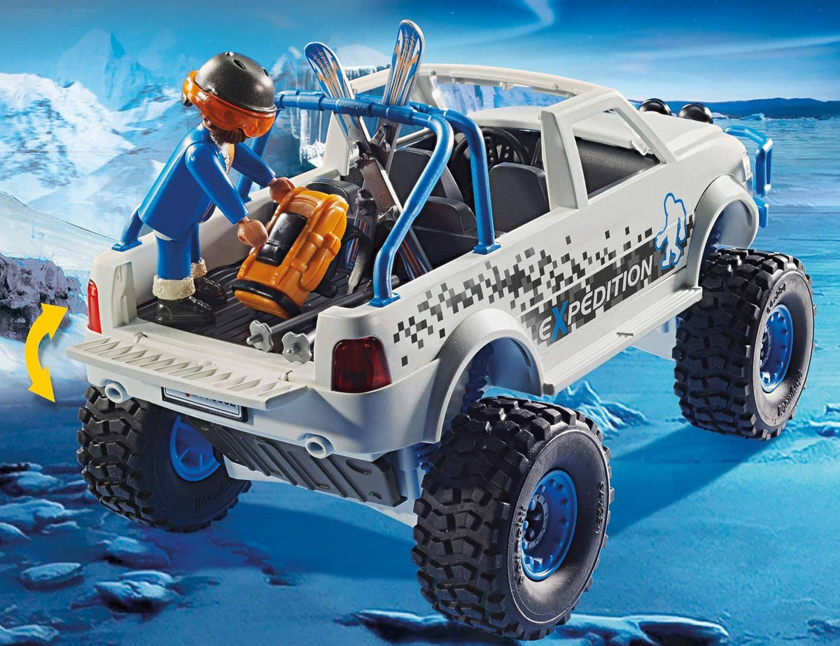 Playmobil off-road snow pickup with orange-helmet driver, open cab, and chunky tires
