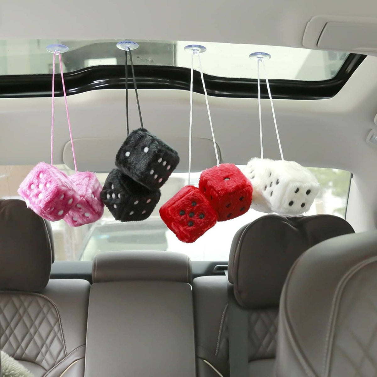 Car ceiling plush dice set with pink, black, red, and white cubes and hanging strings